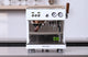 Ascaso Baby T Plus espresso machine in white on a kitchen counter