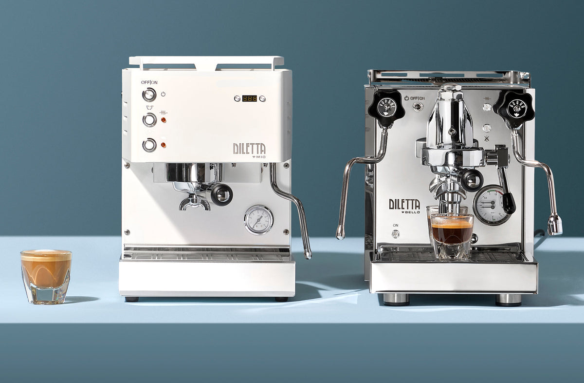 White Diletta Mio beside a stainless steel Diletta Bello+ espresso machine - Seattle Coffee Gear