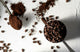 Ground espresso coffee and whole beans compared side by side