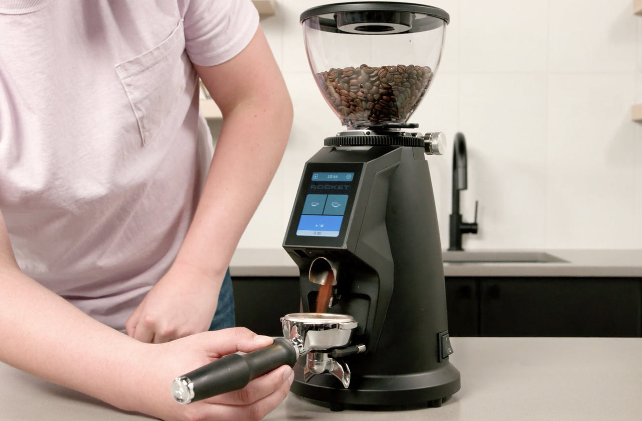 Rocket Espresso Spluga grinder dispensing espresso grounds into a portafilter