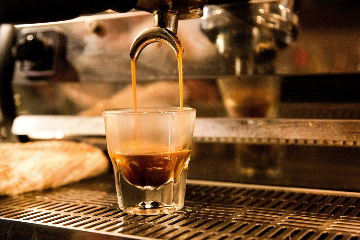 Image of an espresso shot brewing - photo by Drew Beamer via Unsplash - Seattle Coffee Gear