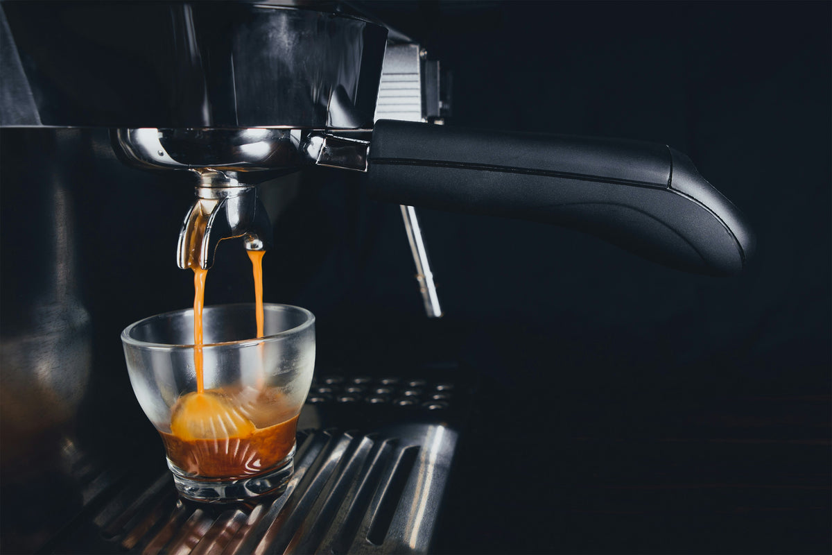 Espresso Shot Pulling Into Shot Glass - Photo by Tim St. Martin on Unsplash - Seattle Coffee Gear
